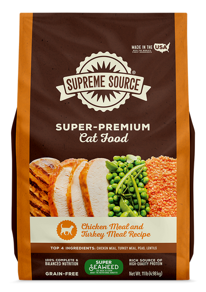 A package of Supreme Source Super-Premium Cat Food with Chicken Meal and Turkey Meal Recipe. The bag is predominantly brown and white, featuring images of chicken and turkey meat, and the text highlights grain-free and top 4 ingredients.