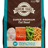 A package of Supreme Source Super-Premium Cat Food with Whitefish Meal and Salmon Meal Recipe. The bag is predominantly brown and blue with images of whitefish and salmon, and it is labeled as grain-free.