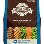 A bag of Supreme Source Premium Dry Dog Food with images of beef and chicken on the front, along with text highlighting the product as grain-free and suitable for all life stages of dogs.