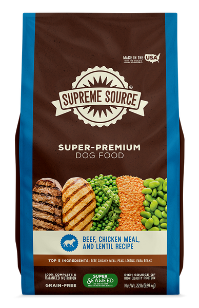 A bag of Supreme Source Premium Dry Dog Food with images of beef and chicken on the front, along with text highlighting the product as grain-free and suitable for all life stages of dogs.