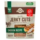 A package of Supreme Source Savory Jerky Cuts premium dog treats with chicken recipe. The packaging is predominantly beige with an image of a chicken and crossed cutlets, highlighting the natural ingredients and super seaweed for digestion.